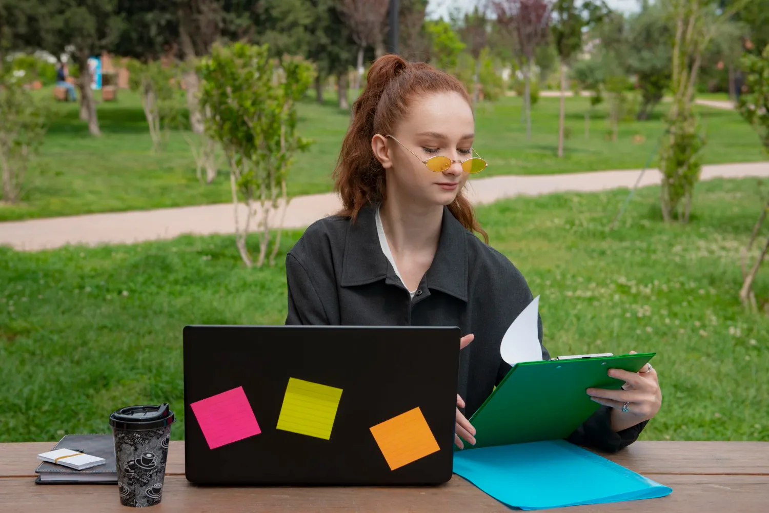 a-student-in-dubai-for-igcse-physics-exams-using-a-laptop-and-notes